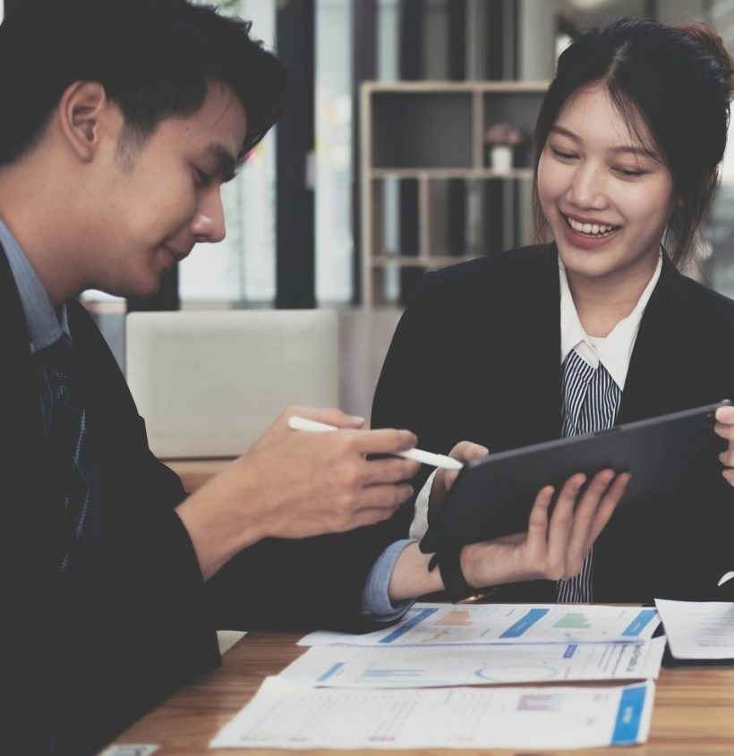 Fund managers team consultation and discuss about analysis Investment stock market by digital tablet Fund managers team consultation and discuss about analysis Investment stock market by digital tablet