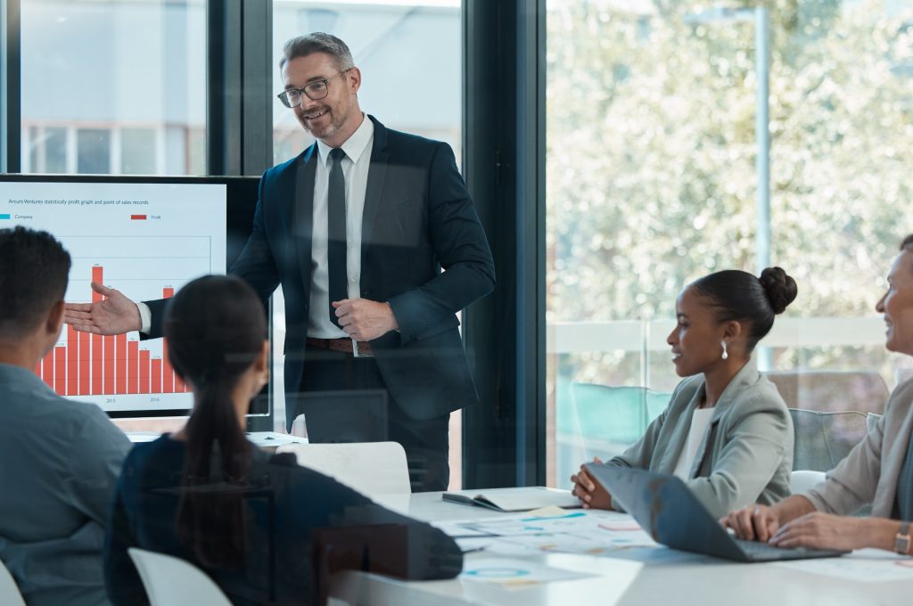 Meeting, training and planning with a CEO, manager or leader and his team in the boardroom. Collabo