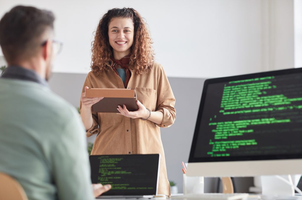 Programmers coding at office